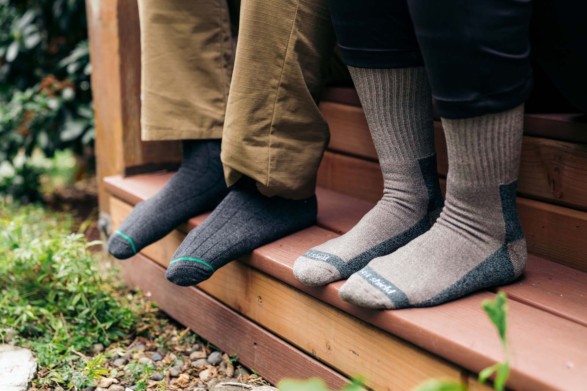 Man and woman wearing permethrin treated socks by Insect Shield